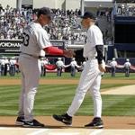 epa03647069 Boston Red Sox manager John Farrell (C-L) and New York Yankees manager Joe Girardi (R) shake hands before the start of their teams games during Opening Day at Yankees Stadium in the Bronx, NY, USA, 01 April 2013. EPA/JASON SZENES